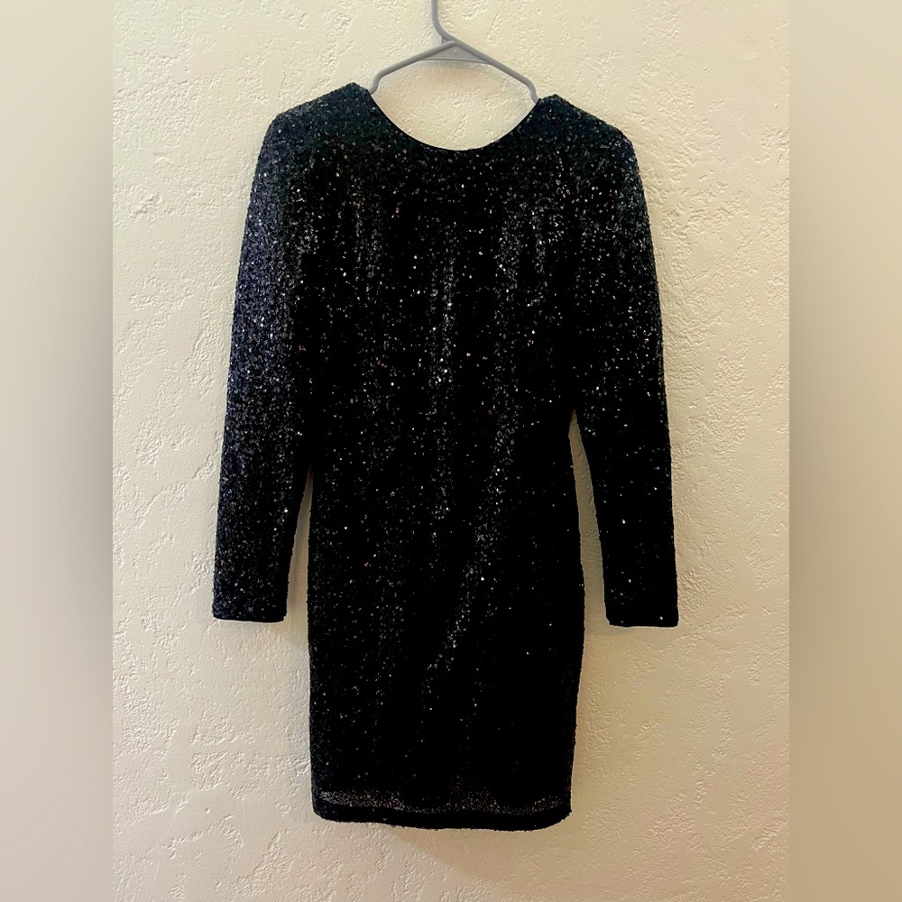 Black sequin backless cocktail dress.